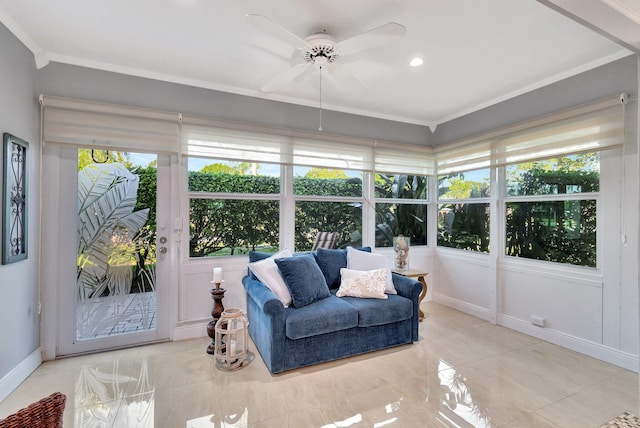 sunroom / solarium featuring ceiling fan