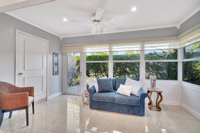 sunroom / solarium featuring plenty of natural light and ceiling fan