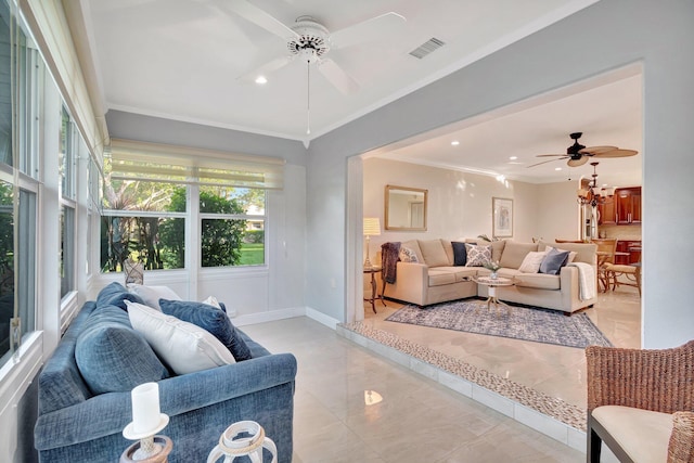 living room featuring ceiling fan and crown molding