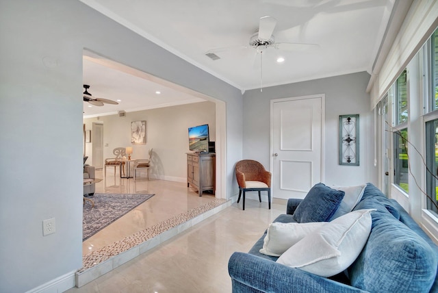 living room with crown molding and ceiling fan