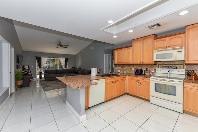 kitchen with kitchen peninsula, white appliances, ceiling fan, sink, and light tile patterned floors