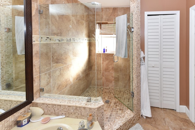 bathroom with tile patterned floors and walk in shower