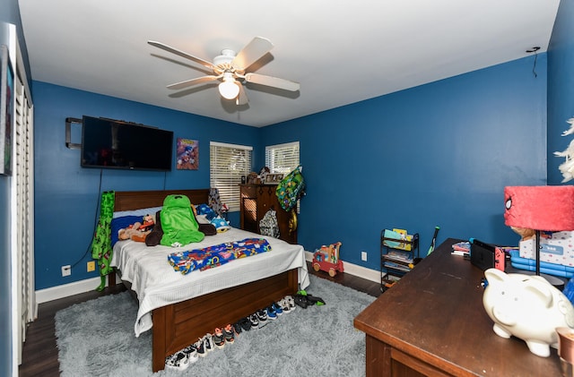 bedroom featuring hardwood / wood-style flooring and ceiling fan