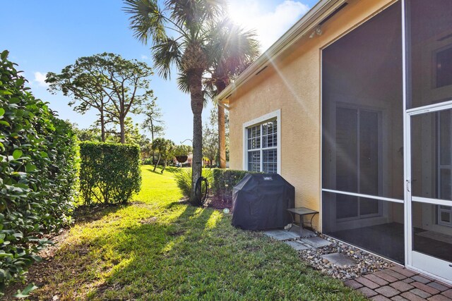 view of yard with a sunroom