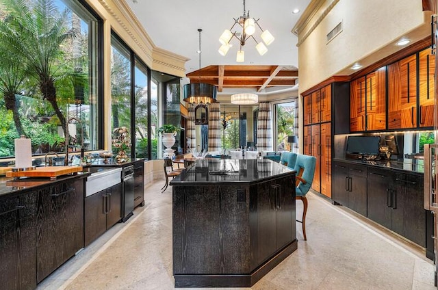 kitchen featuring beam ceiling, a center island, coffered ceiling, a notable chandelier, and a breakfast bar area