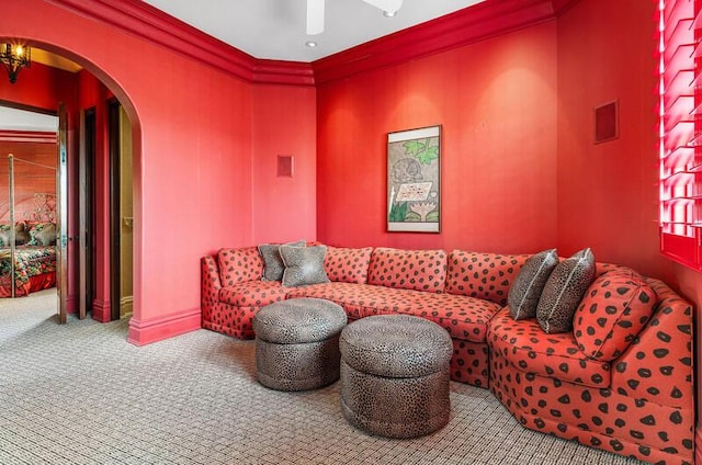 carpeted living room with ornamental molding