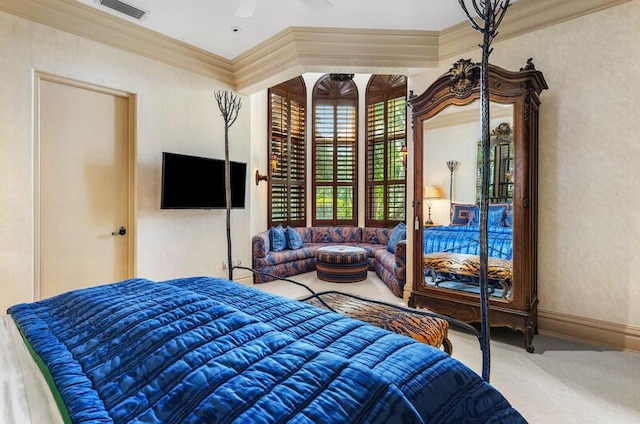 bedroom featuring ceiling fan and ornamental molding