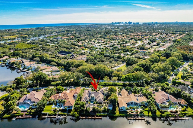 birds eye view of property featuring a water view