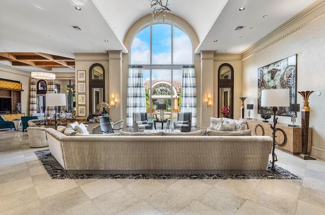 living room with beamed ceiling, ornamental molding, and coffered ceiling