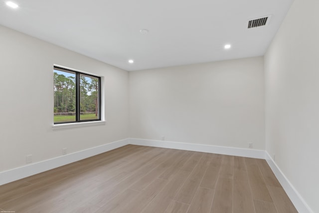 spare room with light hardwood / wood-style floors