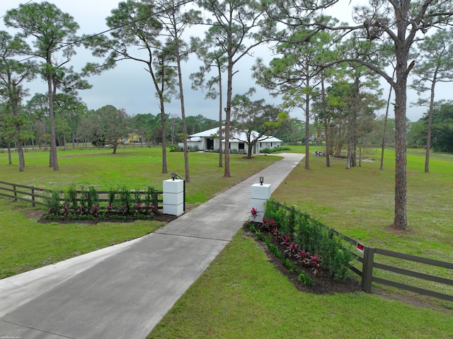 view of property's community with a yard