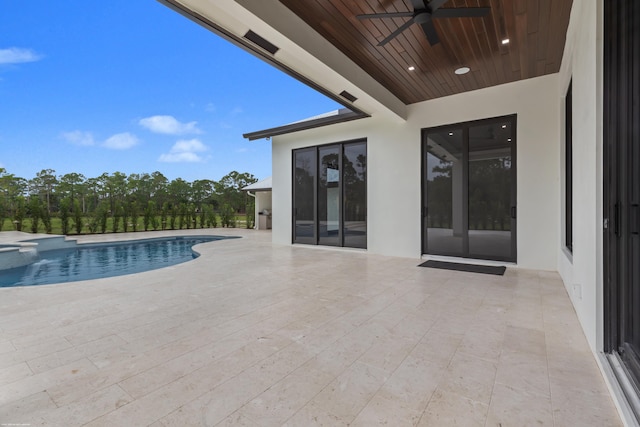 view of pool with a patio area, ceiling fan, and a hot tub