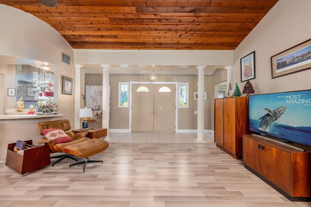 entrance foyer featuring decorative columns, light hardwood / wood-style flooring, lofted ceiling, and wood ceiling