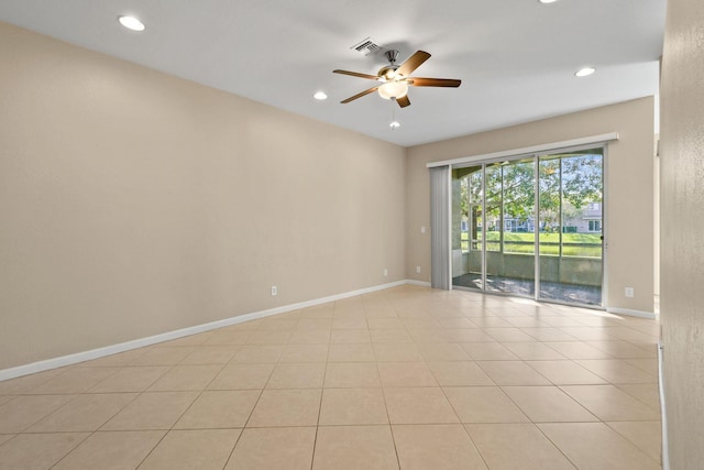 tiled empty room with ceiling fan