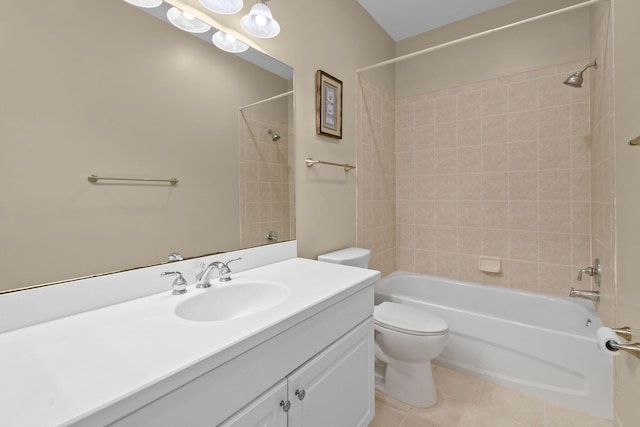 full bathroom with tile patterned floors, tiled shower / bath combo, toilet, and vanity