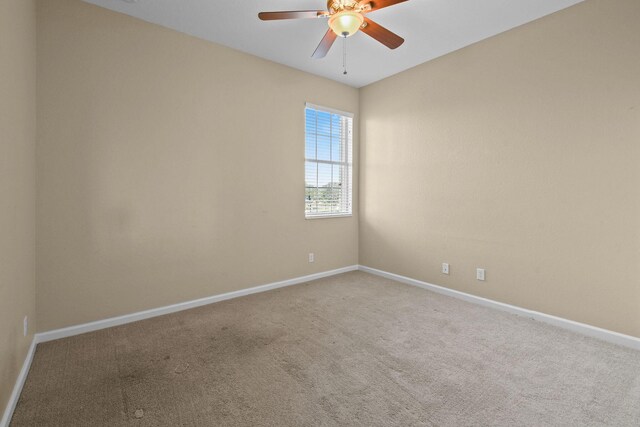 empty room with carpet flooring and ceiling fan