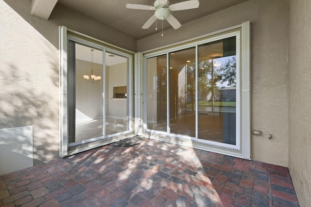 exterior space with ceiling fan