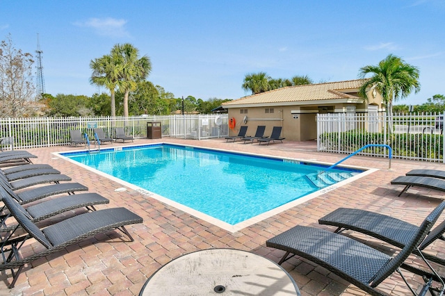 view of swimming pool featuring a patio area