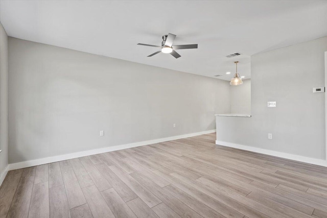 spare room with ceiling fan and light hardwood / wood-style floors