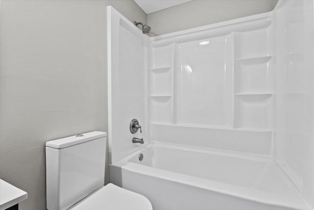 full bathroom with toilet, vanity, and washtub / shower combination