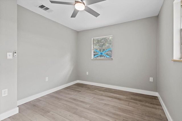 spare room featuring ceiling fan and light wood-type flooring