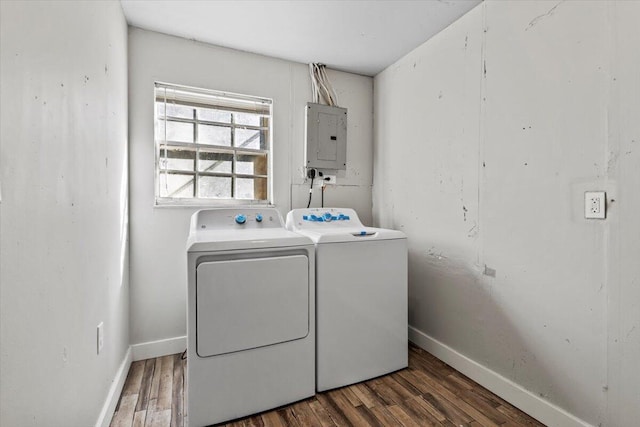 laundry room with independent washer and dryer, dark hardwood / wood-style flooring, and electric panel