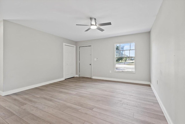 empty room featuring light hardwood / wood-style floors and ceiling fan