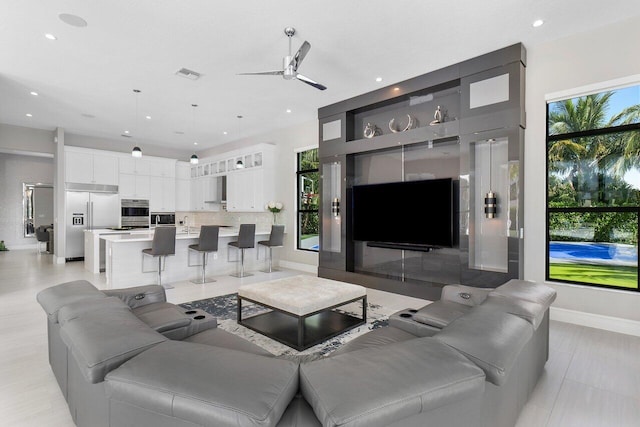 living room featuring ceiling fan