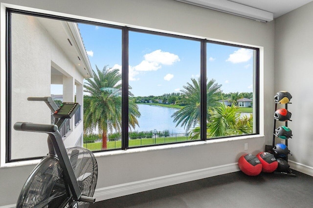 exercise area with a water view