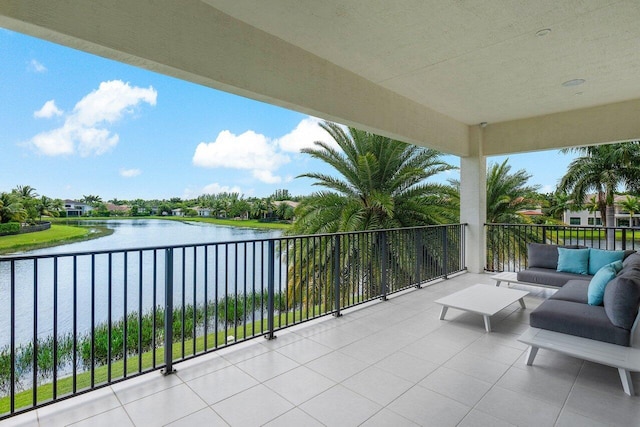 balcony featuring a water view and an outdoor hangout area