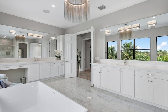 bathroom featuring separate shower and tub and vanity