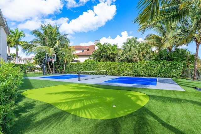 view of basketball court with a lawn and tennis court