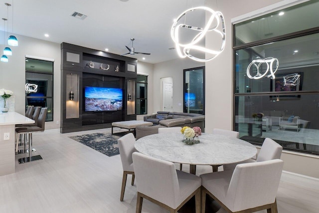 dining space with ceiling fan