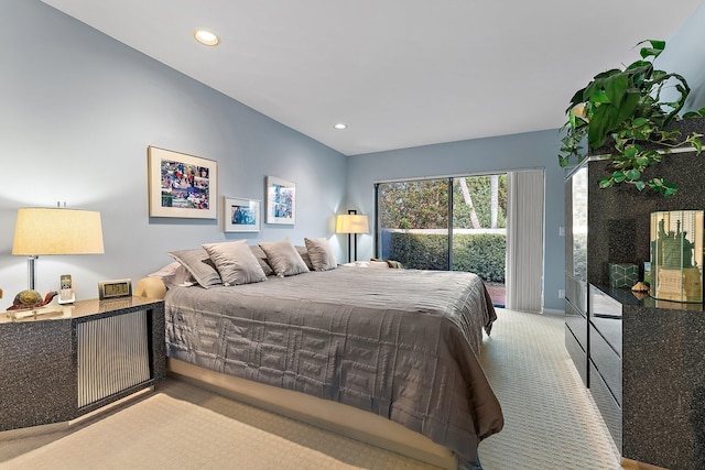 bedroom featuring light carpet and access to outside