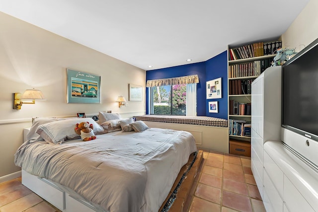 bedroom with light tile patterned floors