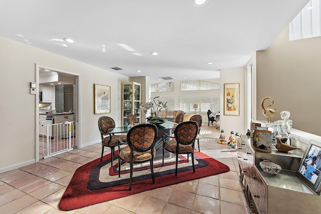 tiled dining space featuring a wealth of natural light