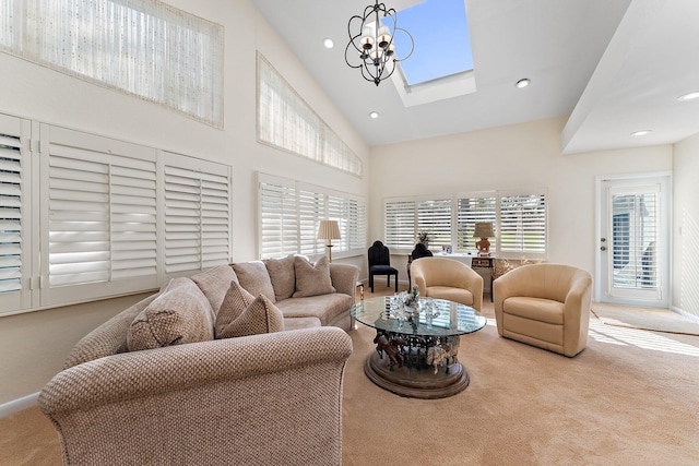 carpeted living room with high vaulted ceiling and a chandelier