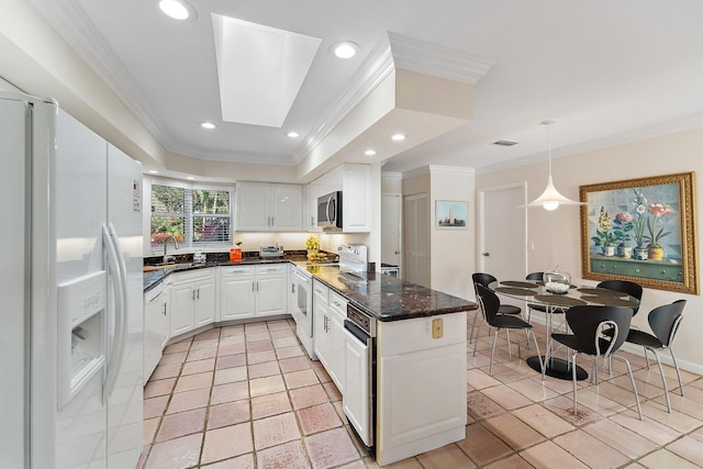 kitchen featuring white cabinets, crown molding, white appliances, and sink