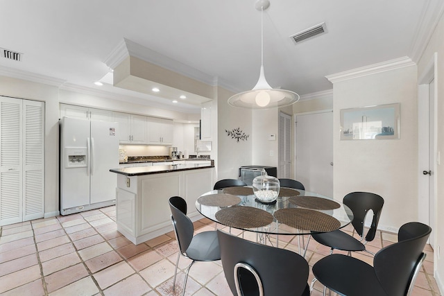 dining area featuring ornamental molding