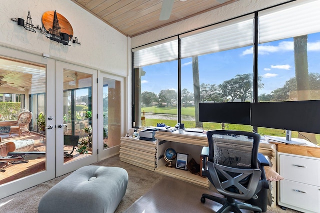 carpeted office space featuring ceiling fan, french doors, and wood ceiling