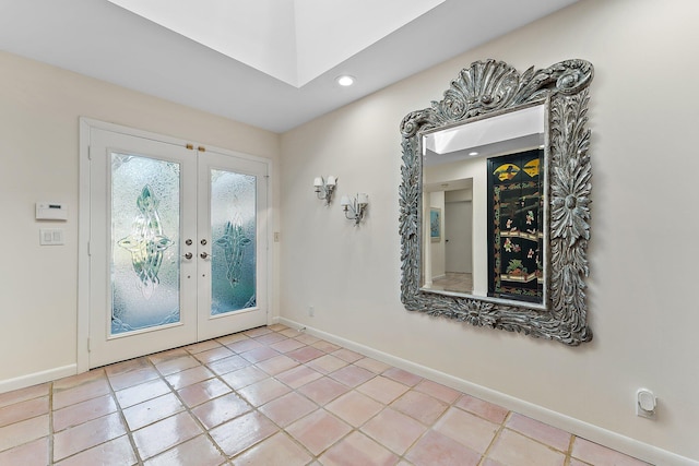 tiled foyer entrance featuring french doors