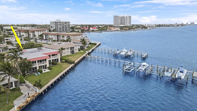 birds eye view of property with a water view