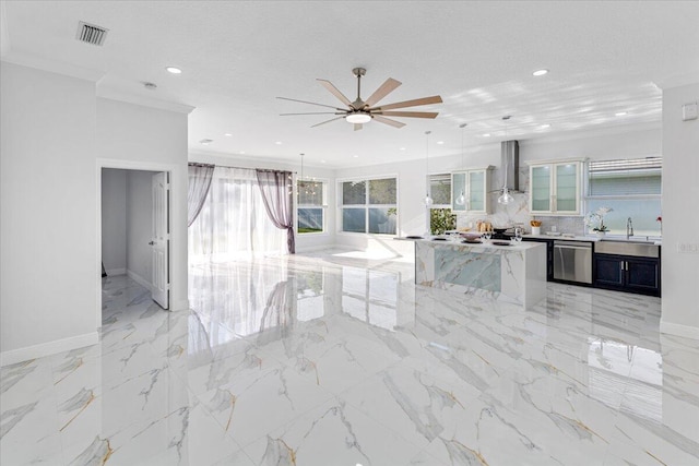 kitchen featuring a textured ceiling, dishwasher, wall chimney range hood, and hanging light fixtures