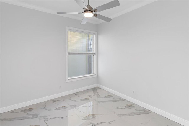 empty room with ceiling fan and ornamental molding