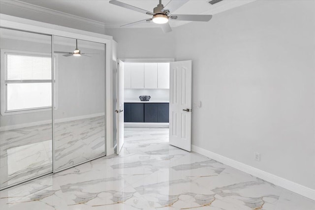 unfurnished bedroom featuring ceiling fan, a closet, and ornamental molding