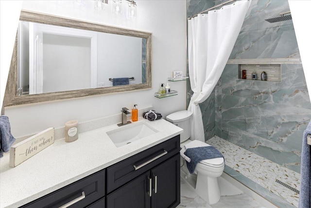 bathroom featuring a shower with curtain, vanity, and toilet