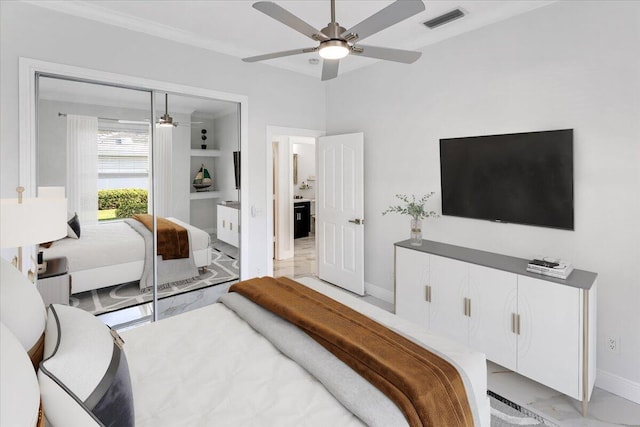 bedroom featuring ceiling fan and ornamental molding