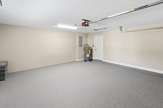 garage featuring electric panel, a garage door opener, and water heater