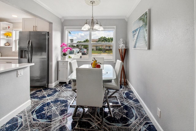 dining area featuring crown molding and a chandelier