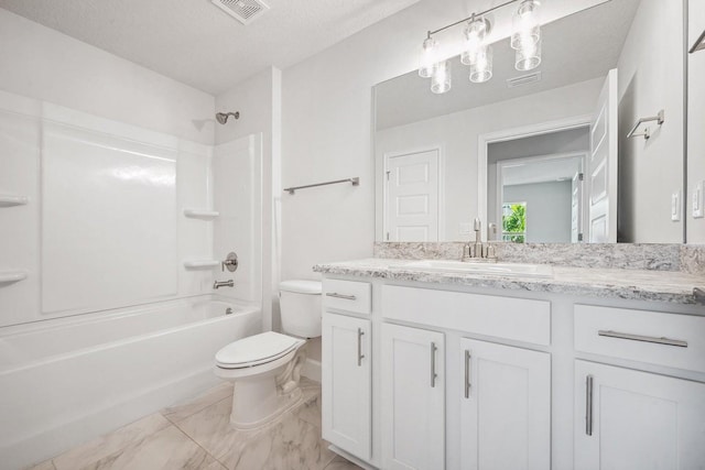 full bathroom featuring vanity, toilet, shower / tub combination, and a textured ceiling